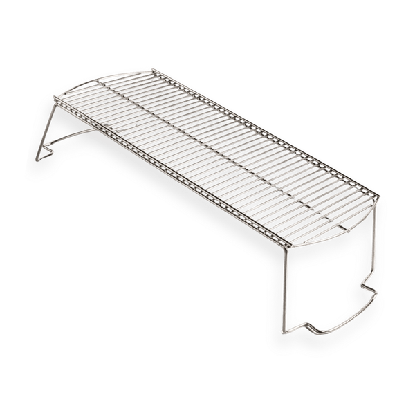 Stainless steel grill warming rack with raised legs on white background