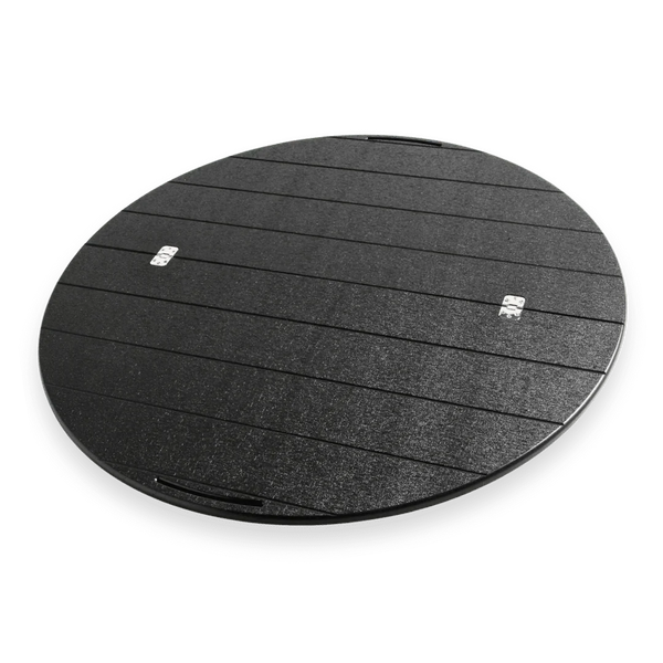 Round black Lazy Susan grill accessory with textured finish and horizontal grooves