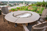 Outdoor round multi-functional grill and dining table set on a rooftop garden with city view