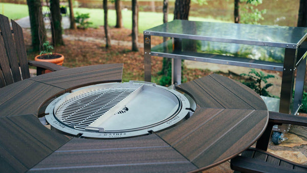 5-in-1 outdoor rotating charcoal grill with wood dining table on patio