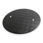 Round black Lazy Susan grill accessory with textured finish and horizontal grooves